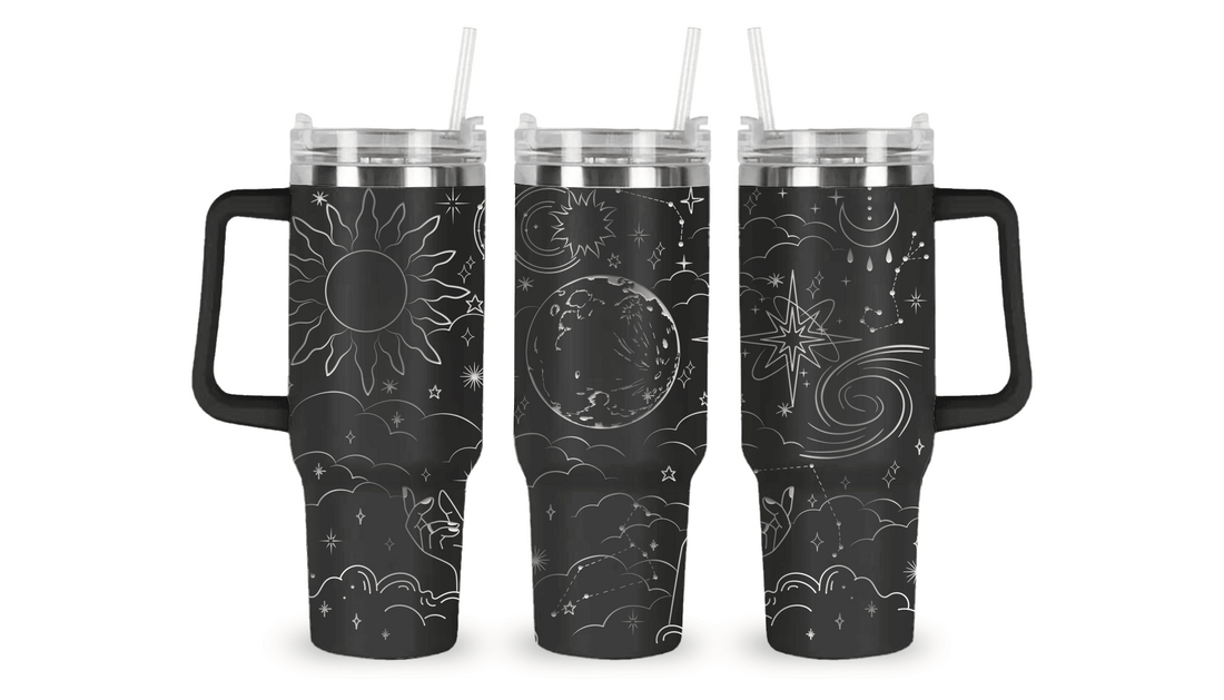 Engraved tumbler with celestial design featuring stars, moons, and planets.