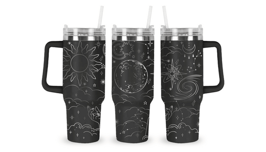 Engraved tumbler with celestial design featuring stars, moons, and planets.