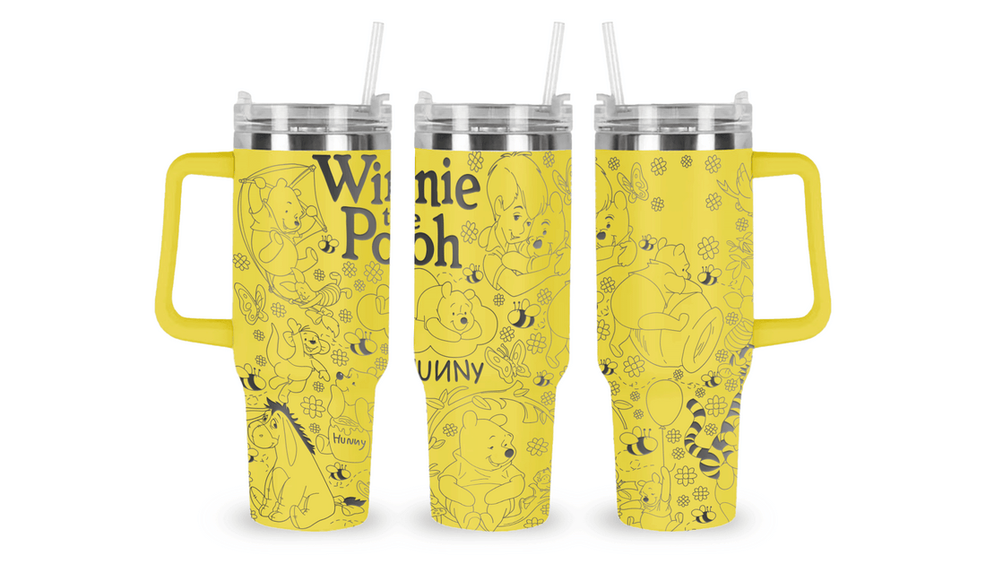 Stainless steel tumbler with an engraved Winnie the Pooh design, featuring Pooh, Piglet, and Hundred Acre Wood details.