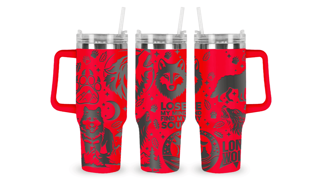 Stainless steel tumbler with an engraved wolf design, featuring a howling wolf and moon details.